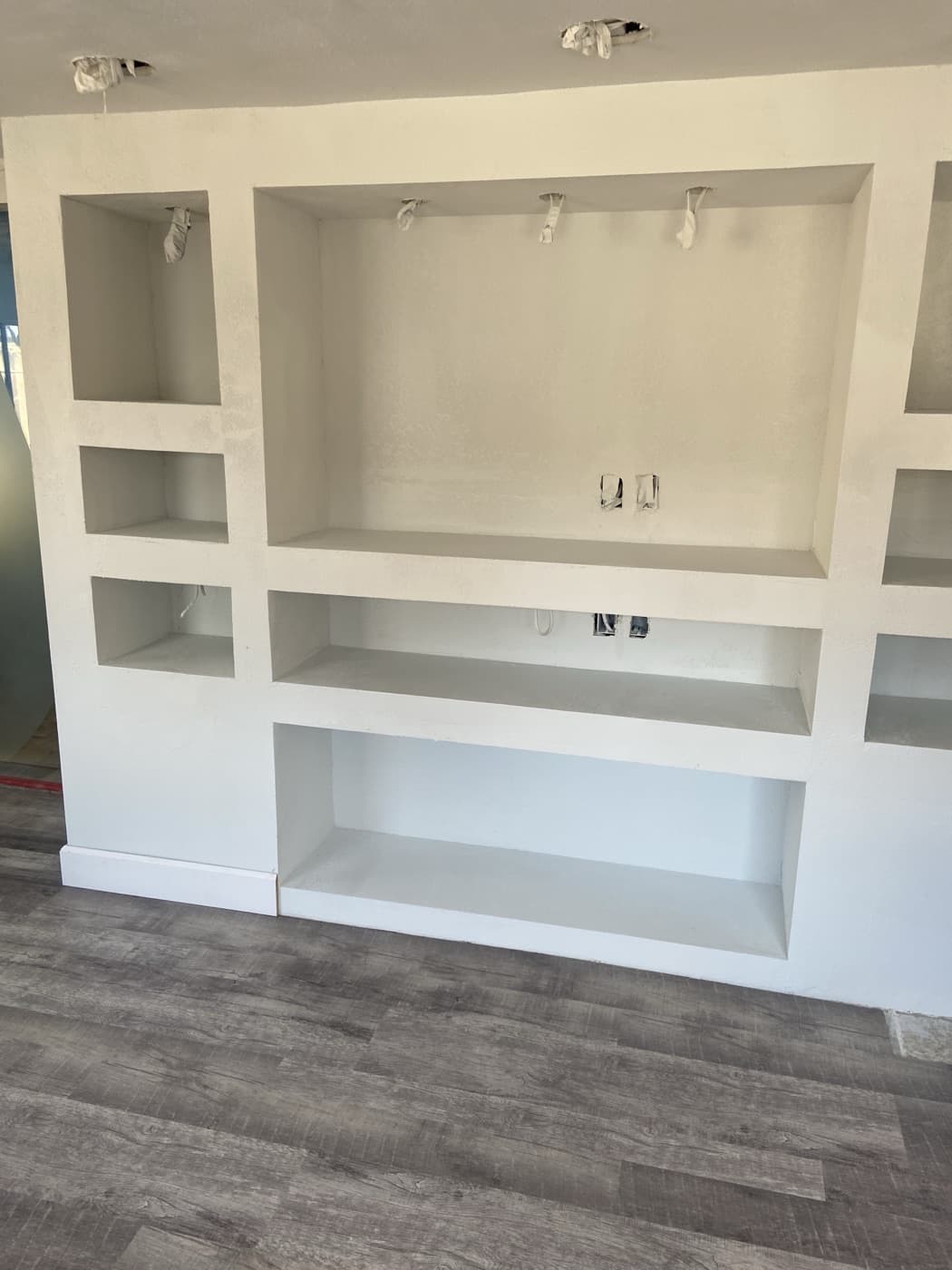 Finished white built-in shelving unit